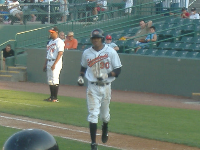 A dirty David Cash trots back to the dugout during an early August game.